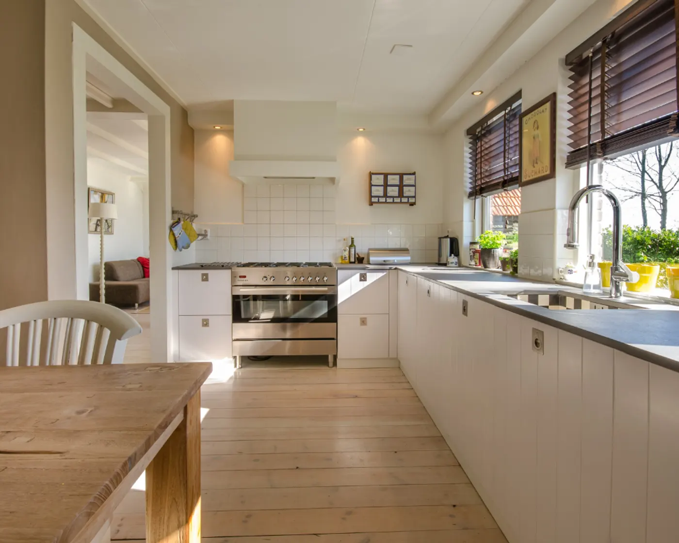 A bright kitchen with clear counters and mopped floors